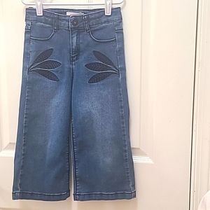 Catimini fancy jeans decorated with the leafs embroidery for a girl size…